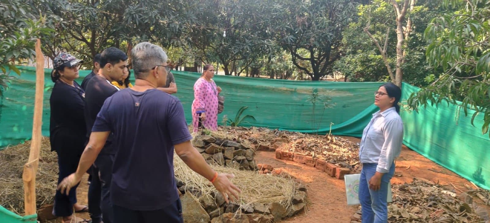 Participants learning hands-on permaculture techniques